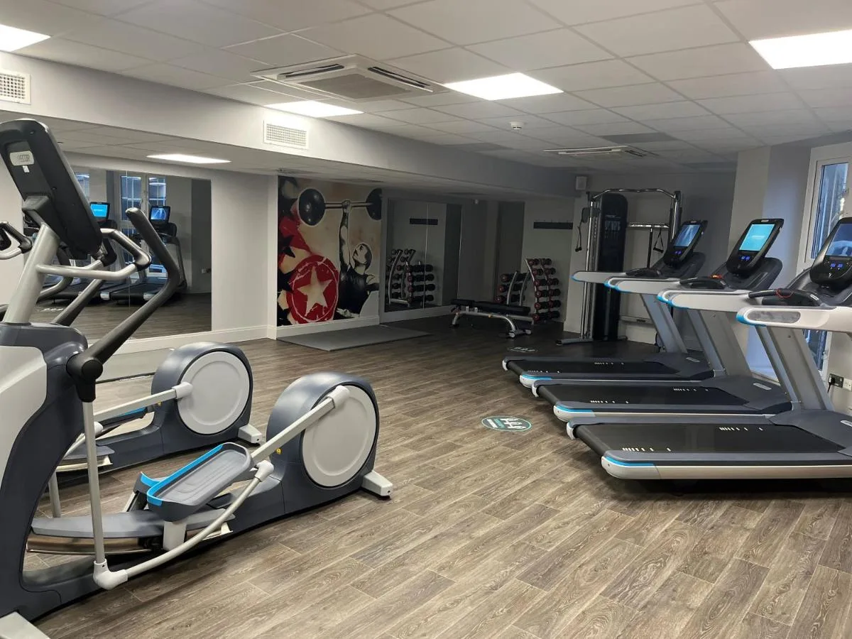 On-site fitness centre with treadmills and cardio equipment at Hotel Indigo Cardiff